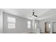 Bright living room showcases wood-look floors, and a ceiling fan at 9644 Flying Eagle Ln, Las Vegas, NV 89123
