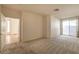 Inviting bedroom with soft carpeting and a sliding glass door to the outside at 1012 Collingtree St, Las Vegas, NV 89145