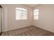 Bedroom featuring carpeted floors and two windows for natural light at 1012 Collingtree St, Las Vegas, NV 89145