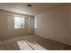 Bedroom featuring carpeted floors and two windows for natural light at 1012 Collingtree St, Las Vegas, NV 89145