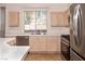 Well-lit kitchen with stainless steel appliances and neutral cabinetry at 1012 Collingtree St, Las Vegas, NV 89145