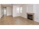 Comfortable living room with a fireplace, large windows, and tile flooring at 1012 Collingtree St, Las Vegas, NV 89145