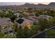 Features a backyard pool, desert landscaping, and neighboring houses with solar panels against a mountain backdrop at 1016 Sable Mist Ct, Las Vegas, NV 89144
