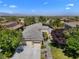 Aerial view of the home, showcasing the neighborhood, landscaping, and mountain views at 1016 Sable Mist Ct, Las Vegas, NV 89144