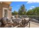 A shaded balcony featuring comfortable chairs and a table for entertaining at 1016 Sable Mist Ct, Las Vegas, NV 89144