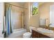 Bathroom features a tub/shower combo, granite countertop and vanity at 1016 Sable Mist Ct, Las Vegas, NV 89144