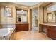 Spacious bathroom with large framed mirrors, a soaking tub, and vanity at 1016 Sable Mist Ct, Las Vegas, NV 89144