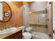 Bathroom features a seamless glass enclosed shower with built in seat and decorative granite countertop at 1016 Sable Mist Ct, Las Vegas, NV 89144