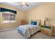 Bedroom with a soft color palette and one window for natural light at 1016 Sable Mist Ct, Las Vegas, NV 89144