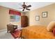 A cozy bedroom with an armoire, area rug, and a window offering natural light at 1016 Sable Mist Ct, Las Vegas, NV 89144