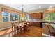 Dining area with wood table, chandelier, and views of the backyard at 1016 Sable Mist Ct, Las Vegas, NV 89144