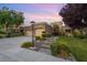 Charming single-story home with a well-manicured lawn, desert landscaping, and a paved walkway leading to the front door at 1016 Sable Mist Ct, Las Vegas, NV 89144