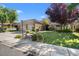 Beautiful single-story home featuring a three-car garage and manicured front yard at 1016 Sable Mist Ct, Las Vegas, NV 89144