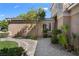 Lush landscaping and a stone walkway enhance the curb appeal of this home at 1016 Sable Mist Ct, Las Vegas, NV 89144