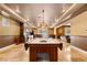 Spacious game room featuring a pool table, and a kitchenette with custom cabinetry at 1016 Sable Mist Ct, Las Vegas, NV 89144