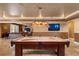 Game room features a pool table and a tv at 1016 Sable Mist Ct, Las Vegas, NV 89144