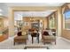 Well-appointed living room showcasing neutral walls, carpet floors and an adjacent dining area at 1016 Sable Mist Ct, Las Vegas, NV 89144