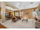 Spacious living room featuring carpet floors, neutral walls and a dining area at 1016 Sable Mist Ct, Las Vegas, NV 89144