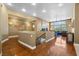 Upstairs loft area with hardwood floors, natural light, and comfortable sitting area at 1016 Sable Mist Ct, Las Vegas, NV 89144
