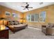 Main bedroom featuring a ceiling fan, natural light and neutral decor at 1016 Sable Mist Ct, Las Vegas, NV 89144