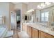 Elegant Primary bathroom featuring double sinks, a soaking tub, and ample counter space at 10320 Luxembourg Ave, Las Vegas, NV 89145