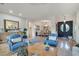 Inviting living room featuring stylish furniture, tile floors, and easy access to other living areas at 10320 Luxembourg Ave, Las Vegas, NV 89145