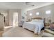 Spacious main bedroom with access to the ensuite bathroom and hallway at 10320 Luxembourg Ave, Las Vegas, NV 89145