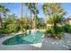 Inviting pool with attached spa surrounded by lush, mature landscaping and an open sky at 10320 Luxembourg Ave, Las Vegas, NV 89145