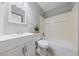 Neutral bathroom features white vanity, updated fixtures, and combined shower and tub at 104 Stanford St, Las Vegas, NV 89107