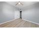 A bedroom features neutral walls, wood-look flooring, and a ceiling fan at 104 Stanford St, Las Vegas, NV 89107