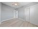 A bedroom features neutral walls, wood-look flooring, and a ceiling fan at 104 Stanford St, Las Vegas, NV 89107