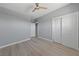 A bedroom features neutral walls, wood-look flooring, and a ceiling fan at 104 Stanford St, Las Vegas, NV 89107