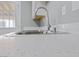 Close up on kitchen countertop showcasing the modern countertops and fixtures at 104 Stanford St, Las Vegas, NV 89107