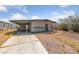 Exterior of the house with ample parking, and low maintenance desert landscaping at 104 Stanford St, Las Vegas, NV 89107