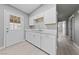 Bright kitchen featuring white cabinets, quartz countertops and stainless steel appliances at 104 Stanford St, Las Vegas, NV 89107