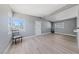 Bright living room features neutral paint, beamed ceilings and updated flooring at 104 Stanford St, Las Vegas, NV 89107