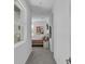 Hallway view to bedroom featuring a neutral palette and natural light at 10752 Patina Hills Ct, Las Vegas, NV 89135