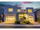 Contemporary two-story home features a three-car garage and minimalist landscaping at 10752 Patina Hills Ct, Las Vegas, NV 89135