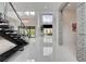 Grand foyer with soaring ceilings, statement staircase, and marble floors offers a luxurious entrance at 10752 Patina Hills Ct, Las Vegas, NV 89135