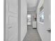 Hallway featuring white walls, modern doors and trim, and view to outside patio at 10752 Patina Hills Ct, Las Vegas, NV 89135