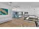 Hallway with wood floors, glass railing, and chandelier at 10752 Patina Hills Ct, Las Vegas, NV 89135