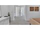Bright hallway with neutral paint and carpet leading to other rooms in the home at 10752 Patina Hills Ct, Las Vegas, NV 89135
