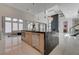 Modern kitchen with large island, stainless steel appliances, and sleek cabinetry at 10752 Patina Hills Ct, Las Vegas, NV 89135