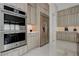 Modern kitchen equipped with stainless steel appliances, sleek cabinetry, and ample counter space at 10752 Patina Hills Ct, Las Vegas, NV 89135