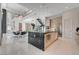 Bright, open kitchen with a spacious island, modern appliances, and elegant finishes at 10752 Patina Hills Ct, Las Vegas, NV 89135