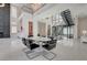 Open-concept living area with modern chandeliers, sleek staircases, and spacious layout at 10752 Patina Hills Ct, Las Vegas, NV 89135