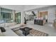 Open concept living area showcasing the kitchen, staircase, and an inviting seating space at 10752 Patina Hills Ct, Las Vegas, NV 89135