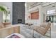 Spacious living room with fireplace and bar area, perfect for entertaining guests at 10752 Patina Hills Ct, Las Vegas, NV 89135