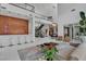 Spacious open-concept living area with staircase and bar with ample seating at 10752 Patina Hills Ct, Las Vegas, NV 89135