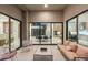 This luxury patio offers an outdoor living space with views of the home's modern interior at 10752 Patina Hills Ct, Las Vegas, NV 89135